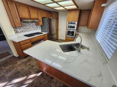 Kitchen with quartz island and new cabinetry