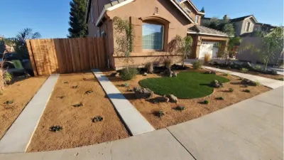 New front-yard landscaping with turf, gravel and planting