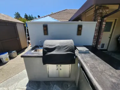 Built-in grill station with a stucco finish