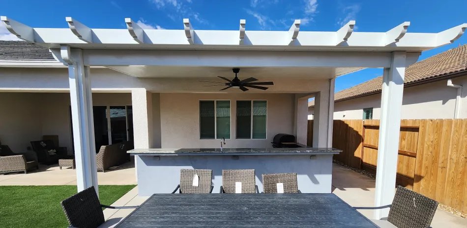 White patio cover over a new patio with outdoor bar seating in Fair Oaks, CA